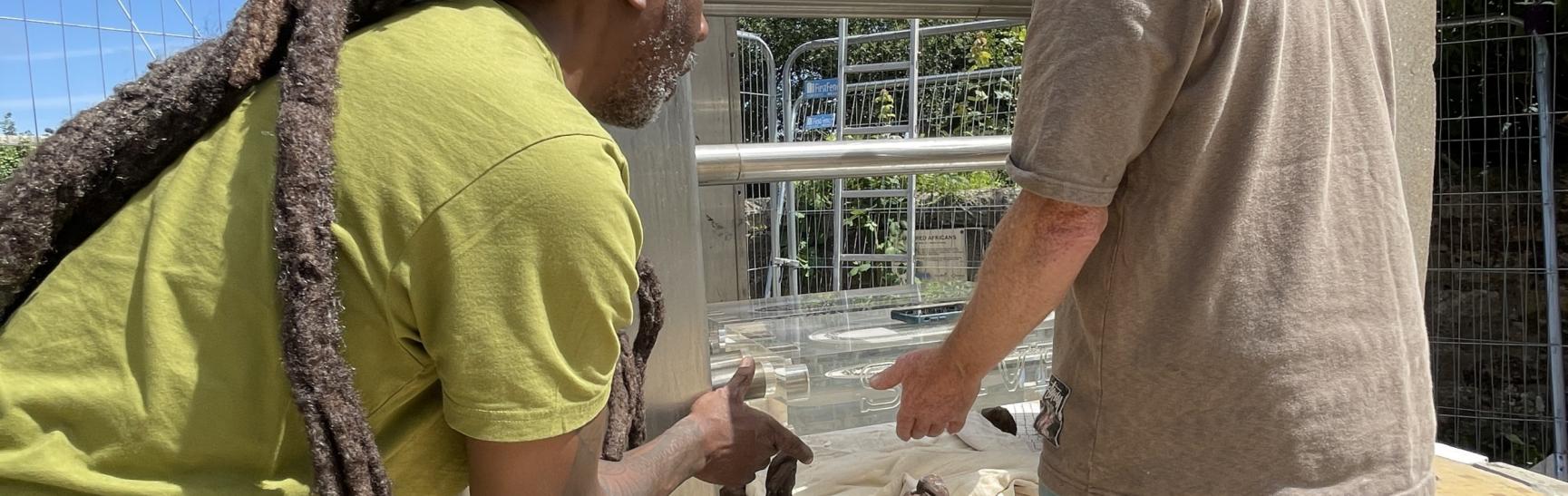 Captured African Shane Johnstone And Kevin Restoring The Sculture